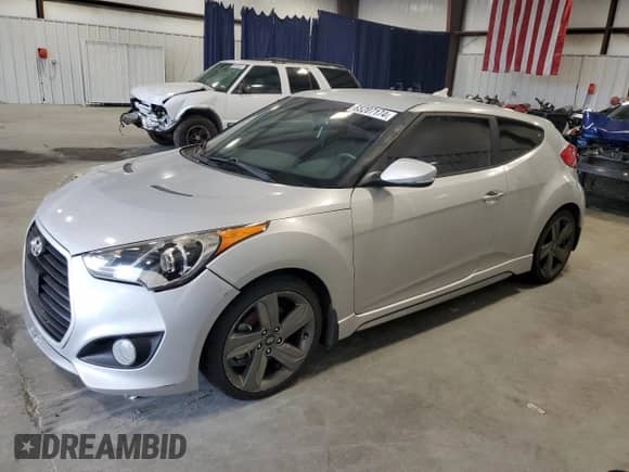 2014 Hyundai Veloster Turbo z VIN KMHTC6AE2EU208474, wystawiony jako Copart lot #65442584 z przebiegiem 57 596 mil mil oraz Szkoda całkowita • Salvage title. Historia ofert i sprzedaży dostępna na DreamBid. Obrazek 1.