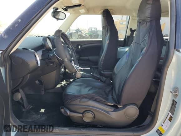 2013 MINI Hardtop with VIN WMWSU3C55DT681697, listed as a Copart auction lot 50325745 with 68,386 mi miles and Salvage title. Bid and sale history available at DreamBid. Image 7.