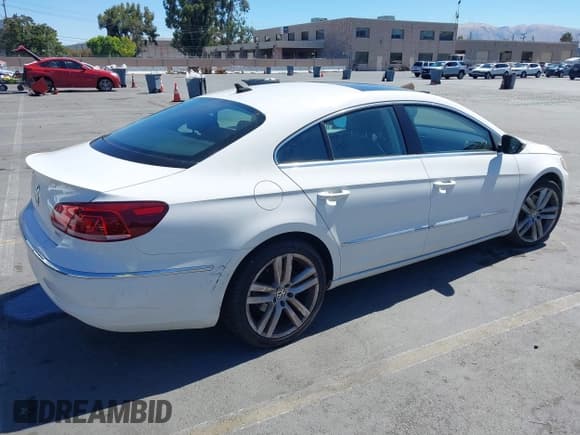 ✅ 2014 Volkswagen CC Executive • VIN: WVWRP7AN4EE507919 • Lot: 42990421. Listed on IAAI with 106,338 mi. Free auction sales archive from the USA and detailed vehicle history report at DreamBid. Image 4.