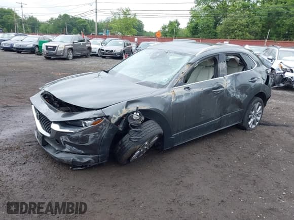 ✅ 2023 Mazda CX-30 S Premium • VIN: 3MVDMBDM9PM570034 • Lot: 42472588. Listed on IAAI with 30,715 mi. Free auction sales archive from the USA and detailed vehicle history report at DreamBid. Image 19.