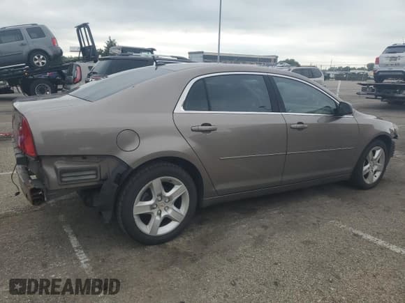✅ 2011 Chevrolet Malibu 1LS • VIN: 1G1ZB5E12BF232415 • Lot: 65534654. Listed on Copart with 110,594 mi. Free auction sales archive from the USA and detailed vehicle history report at DreamBid. Image 3.