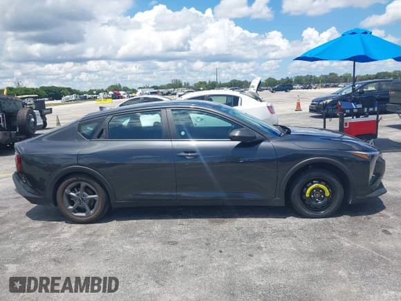 ✅ 2025 Kia K4 LXS • VIN: 3KPFT4DE1SE021125 • Lot: 43012476. Listed on IAAI with 16,563 mi. Free auction sales archive from the USA and detailed vehicle history report at DreamBid. Image 13.