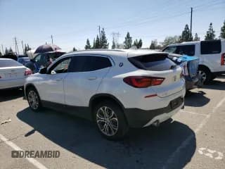 ✅ 2022 BMW X2 sDrive28i • VIN: WBXYH9C07N5T49777 • Лот: 48014423. Опубликован ранее на Copart с пробегом 27 134 миль. Бесплатный доступ к архиву аукционных продаж из США и подробный отчёт об истории автомобиля на DreamBid. Изображение 2.