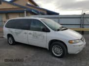 ✅ 2000 Chrysler Town & Country Limited • VIN: 1C4GP64L9YB521378 • Lot: 41983765. Listed on Copart with 74,216 mi. Free auction sales archive from the USA and detailed vehicle history report at DreamBid. Image 4.