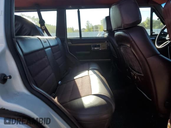 ✅ 1990 Jeep Grand Wagoneer • VIN: 1J4FN78L4LL168868 • Lot: 66625885. Wystawiony na Copart z przebiegiem 166 381 mil. Bezpłatny archiwum sprzedaży aukcyjnych z USA i szczegółowy raport historii pojazdu na DreamBid. Zdjęcie 11.