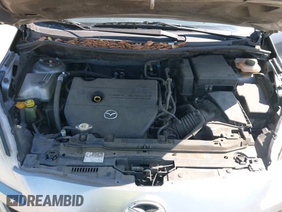 ✅ 2012 Mazda 5 Sport • VIN: JM1CW2BL9C0117627 • Lot: 42403991. Listed on IAAI with 124,239 mi. Free auction sales archive from the USA and detailed vehicle history report at DreamBid. Image 10.