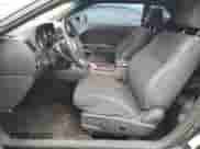 2014 Dodge Challenger SXT z VIN 2C3CDYAG0EH195293, wystawiony jako Copart lot #69801784 z przebiegiem 158 460 mil mil oraz Szkoda całkowita • Salvage title. Historia ofert i sprzedaży dostępna na DreamBid. Obrazek 7.