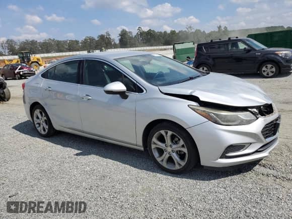 2016 Chevrolet Cruze Premier with VIN 1G1BG5SM0G7269465, listed as a Copart auction lot 82115635 with 143,928 mi miles and Salvage title. Bid and sale history available at DreamBid. Image 4.