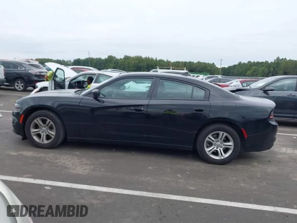 ✅ 2023 Dodge Charger SXT • VIN: 2C3CDXBG5PH579520 • Lot: 43245472. Listed on IAAI with 59,873 mi. Free auction sales archive from the USA and detailed vehicle history report at DreamBid. Image 14.