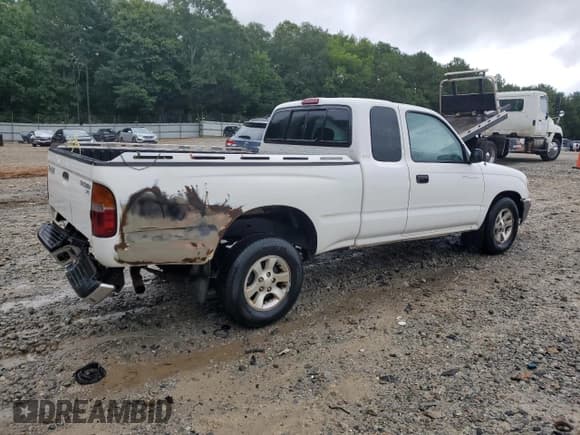 ✅ 1999 Toyota Tacoma • VIN: 4TAVL52N3XZ523937 • Lot: 66933295. Listed on Copart with 284,029 mi. Free auction sales archive from the USA and detailed vehicle history report at DreamBid. Image 3.