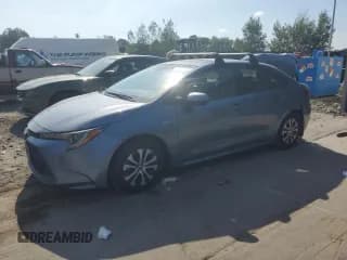 ✅ 2022 Toyota Corolla Hybrid • VIN: JTDBAMDE9N3006226 • Лот: 68340494. Опубликован ранее на Copart с пробегом 22 394 миль. Бесплатный доступ к архиву аукционных продаж из США и подробный отчёт об истории автомобиля на DreamBid. Изображение 1.