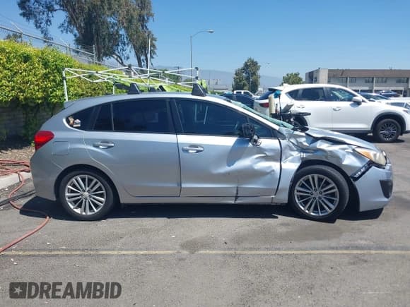 ✅ 2012 Subaru Impreza Premium • VIN: JF1GPAE66CH229646 • Lot: 42837558. Listed on IAAI with 118,893 mi. Free auction sales archive from the USA and detailed vehicle history report at DreamBid. Image 13.