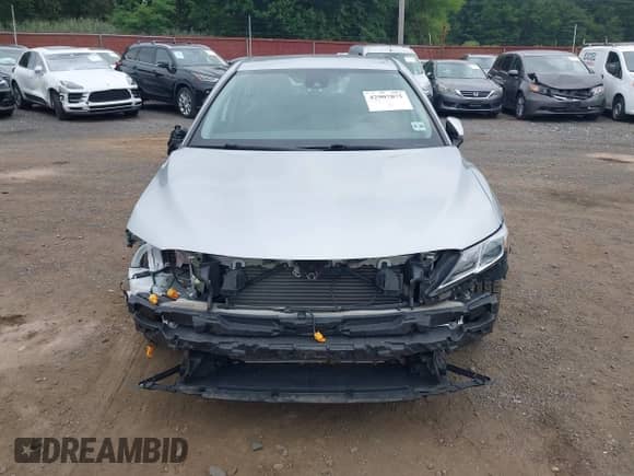 2020 Toyota Camry SE with VIN 4T1G11BKXLU009460, listed as a IAAI auction lot 42907075 with 43,495 mi miles and . Bid and sale history available at DreamBid. Image 12.