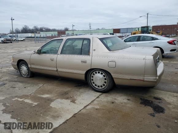 ✅ 1997 Cadillac DeVille • VIN: 1G6KD54Y5VU244028 • Lot: 86650584. Listed on Copart with 57,648 mi. Free auction sales archive from the USA and detailed vehicle history report at DreamBid. Image 2.