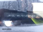 ✅ 2011 Mazda 3 S Grand Touring • VIN: JM1BL1W57B1458513 • Лот: 41585432. Опубликован ранее на IAAI с пробегом Не указан. Бесплатный доступ к архиву аукционных продаж из США и подробный отчёт об истории автомобиля на DreamBid. Изображение 9.