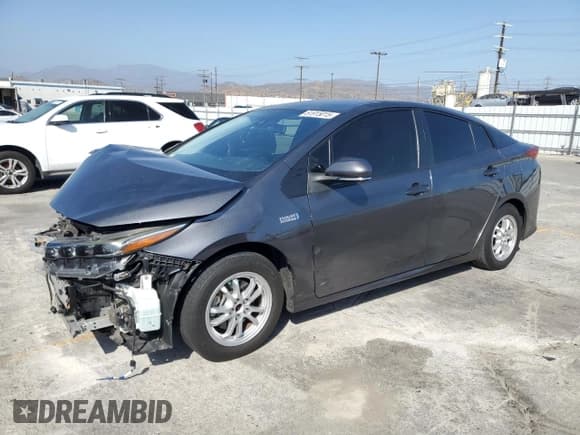 ✅ 2021 Toyota Prius XLE • VIN: JTDKAMFP6M3196497 • Lot: 91421715. Listed on Copart with 111,756 mi. Free auction sales archive from the USA and detailed vehicle history report at DreamBid. Image 1.