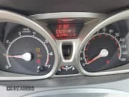 ✅ 2013 Ford Fiesta Titanium • VIN: 3FADP4FJ3DM175257 • Лот: 69178315. Опубликован ранее на Copart с пробегом 76 721 миль. Бесплатный доступ к архиву аукционных продаж из США и подробный отчёт об истории автомобиля на DreamBid. Изображение 9.