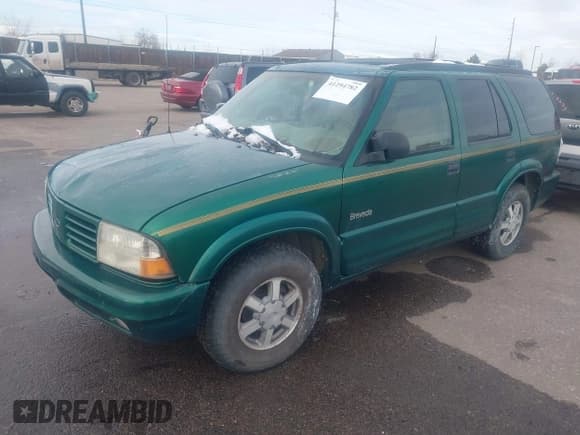 ✅ 1999 Oldsmobile Bravada • VIN: 1GHDT13W7X2711363 • Lot: 41294782. Wystawiony na IAAI z przebiegiem 198 508 mil. Bezpłatny archiwum sprzedaży aukcyjnych z USA i szczegółowy raport historii pojazdu na DreamBid. Zdjęcie 2.