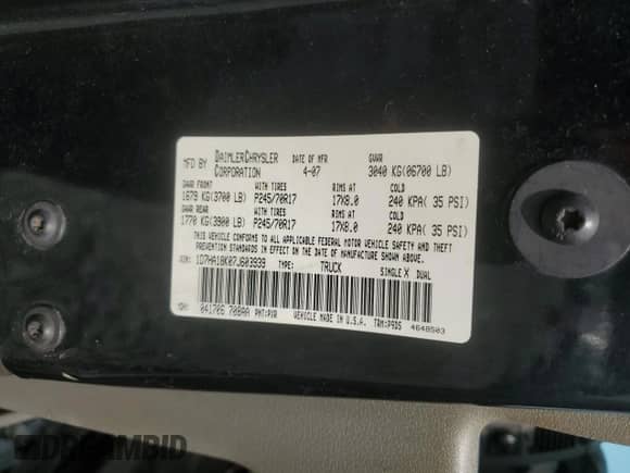 2007 Dodge 1500 ST z VIN 1D7HA18K07J603939, wystawiony jako Copart lot #63998025 z przebiegiem 123 228 mil mil oraz Szkoda całkowita • Salvage title. Historia ofert i sprzedaży dostępna na DreamBid. Obrazek 13.
