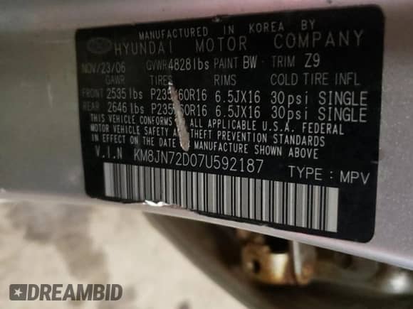 2007 Hyundai Tucson SE z VIN KM8JN72D07U592187, wystawiony jako Copart lot #85103324 z przebiegiem 153 892 mil mil oraz Szkoda całkowita • Salvage title. Historia ofert i sprzedaży dostępna na DreamBid. Obrazek 13.