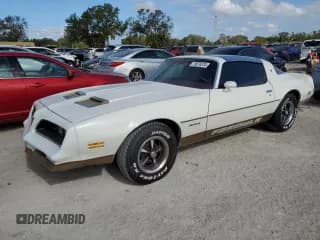 ✅ 1978 Pontiac Firebird • VIN: 2U87K8L123850 • Lot: 79076374. Wystawiony na Copart z przebiegiem 64 829 mil. Bezpłatny archiwum sprzedaży aukcyjnych z USA i szczegółowy raport historii pojazdu na DreamBid. Zdjęcie 1.