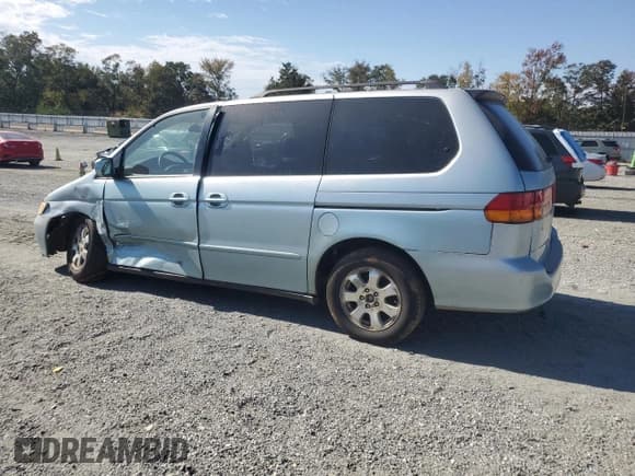✅ 2003 Honda Odyssey EX • VIN: 2HKRL18633H501095 • Lot: 87459365. Listed on Copart with 308,205 mi. Free auction sales archive from the USA and detailed vehicle history report at DreamBid. Image 2.