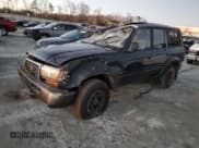 ✅ 1997 Toyota Land Cruiser • VIN: JT3HJ85J1V0161744 • Lot: 86346574. Listed on Copart with 104,904 mi. Free auction sales archive from the USA and detailed vehicle history report at DreamBid. Image 1.