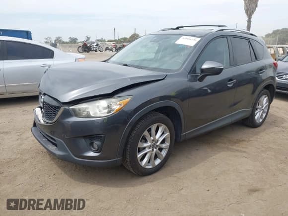 ✅ 2015 Mazda CX-5 Grand Touring • VIN: JM3KE4DY9F0466141 • Lot: 43106230. Listed on IAAI with 130,866 mi. Free auction sales archive from the USA and detailed vehicle history report at DreamBid. Image 2.
