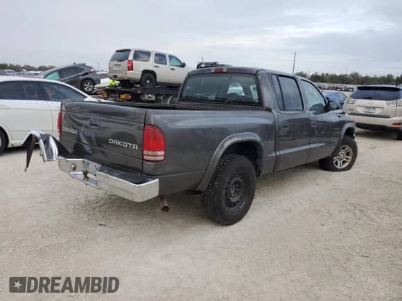 2004 Dodge Dakota Sport с VIN 1D7HL38K64S520463, выставлен на аукционе Copart как лот 79697504 с пробегом Не указан миль и Чистый • Clean title. История ставок и продаж доступна на DreamBid. Изображение 3.