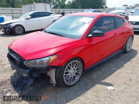 2019 Hyundai Veloster N z VIN KMHT36AH7KU002461, wystawiony jako IAAI lot #42578737 z przebiegiem 135 870 mil mil oraz . Historia ofert i sprzedaży dostępna na DreamBid. Obrazek 2.