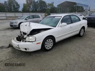 ✅ 2005 Kia Optima LX • VIN: KNAGD126055415305 • Lot: 73147414. Listed on Copart with 256,909 mi. Free auction sales archive from the USA and detailed vehicle history report at DreamBid. Image 1.