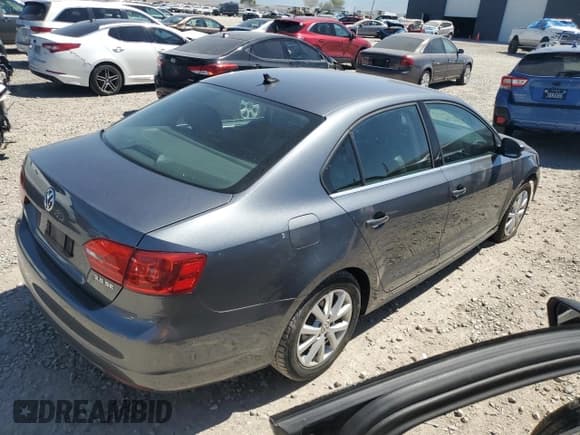 ✅ 2013 Volkswagen Jetta SE • VIN: 3VWDX7AJ3DM271048 • Lot: 59257995. Listed on Copart with 122,393 mi. Free auction sales archive from the USA and detailed vehicle history report at DreamBid. Image 3.