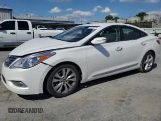 ✅ 2013 Hyundai Azera • VIN: KMHFG4JGXDA325761 • Лот: 70225975. Опубликован ранее на Copart с пробегом 126 944 миль. Бесплатный доступ к архиву аукционных продаж из США и подробный отчёт об истории автомобиля на DreamBid. Изображение 1.