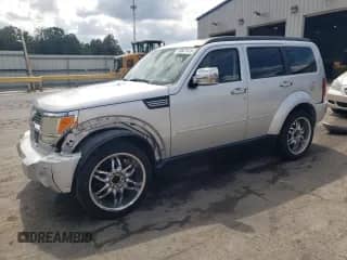 2007 Dodge Nitro SLT z VIN 1D8GT58K57W613376, wystawiony jako Copart lot #70827415 z przebiegiem 198 024 mil mil oraz Szkoda całkowita • Salvage title. Historia ofert i sprzedaży dostępna na DreamBid. Obrazek 1.