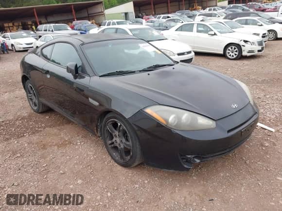2007 Hyundai Tiburon GT z VIN KMHHN66F37U250320, wystawiony jako IAAI lot #42047654 z przebiegiem 231 899 mil mil oraz . Historia ofert i sprzedaży dostępna na DreamBid. Obrazek 1.