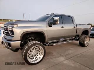 ✅ 2024 Chevrolet Silverado 2500HD LTZ • VIN: 2GC4YPEY0R1173987 • Lot: 86664225. Listed on Copart with 14,504 mi. Free auction sales archive from the USA and detailed vehicle history report at DreamBid. Image 1.