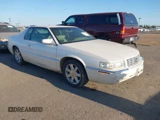✅ 2001 Cadillac Eldorado ESC • VIN: 1G6EL12Y81B104914 • Lot: 42664150. Wystawiony na IAAI z przebiegiem 124 984 mil. Bezpłatny archiwum sprzedaży aukcyjnych z USA i szczegółowy raport historii pojazdu na DreamBid. Zdjęcie 1.