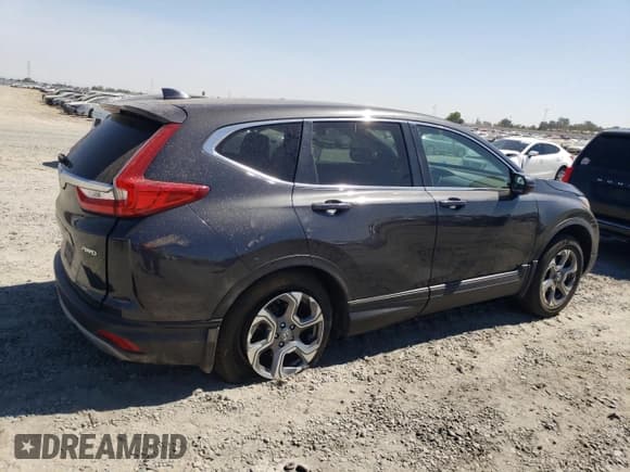 ✅ 2017 Honda CR-V EX • VIN: 2HKRW2H54HH688732 • Лот: 80514985. Опубликован ранее на Copart с пробегом 98 737 миль. Бесплатный доступ к архиву аукционных продаж из США и подробный отчёт об истории автомобиля на DreamBid. Изображение 3.