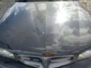 ✅ 1999 Pontiac Bonneville SE • VIN: 1G2HX52K4XH233440 • Лот: 85694595. Опубликован ранее на Copart с пробегом 96 250 миль. Бесплатный доступ к архиву аукционных продаж из США и подробный отчёт об истории автомобиля на DreamBid. Изображение 11.