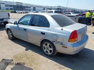 2003 Hyundai Accent GL z VIN KMHCG45C23U427238, wystawiony jako IAAI lot #43412077 z przebiegiem 111 107 mil mil oraz . Historia ofert i sprzedaży dostępna na DreamBid. Obrazek 3.