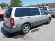 ✅ 2004 Pontiac Montana 1SA • VIN: 1GMDX03E14D192754 • Lot: 42039867. Wystawiony na IAAI z przebiegiem 131 291 mil. Bezpłatny archiwum sprzedaży aukcyjnych z USA i szczegółowy raport historii pojazdu na DreamBid. Zdjęcie 4.