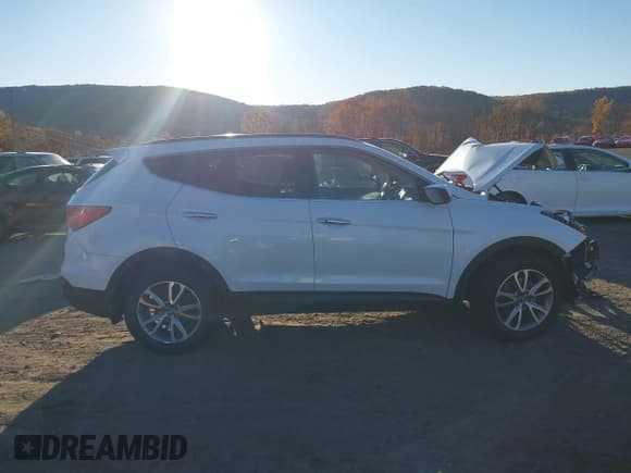 ✅ 2014 Hyundai Santa Fe • VIN: 5XYZUDLA9EG129783 • Lot: 43591728. Listed on IAAI with 76,585 mi. Free auction sales archive from the USA and detailed vehicle history report at DreamBid. Image 14.
