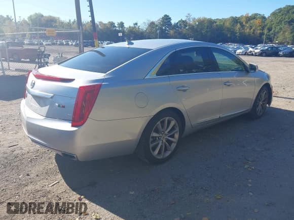 ✅ 2013 Cadillac XTS Luxury • VIN: 2G61P5S3XD9220569 • Lot: 43407862. Listed on IAAI with 121,728 mi. Free auction sales archive from the USA and detailed vehicle history report at DreamBid. Image 4.