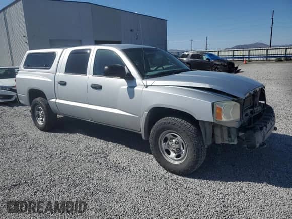 2007 Dodge Dakota ST with VIN 1D3HW28P07S173568, listed as a Copart auction lot 57132075 with 167,477 mi miles and Salvage title. Bid and sale history available at DreamBid. Image 4.