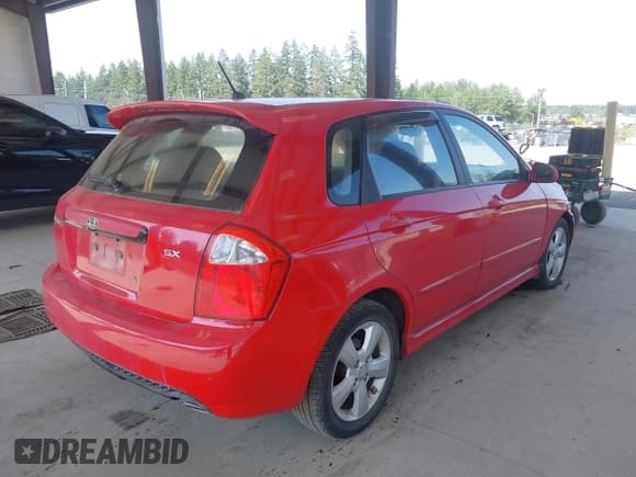 ✅ 2009 Kia Spectra Spectra5 • VIN: KNAFE241595023877 • Lot: 42583449. Listed on IAAI with 160,843 mi. Free auction sales archive from the USA and detailed vehicle history report at DreamBid. Image 4.