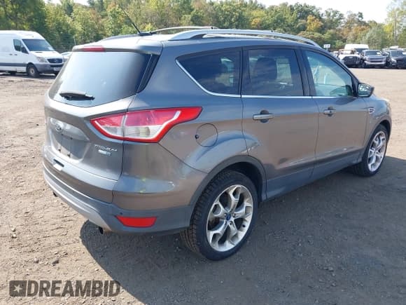 ✅ 2013 Ford Escape Titanium • VIN: 1FMCU9J99DUB51397 • Lot: 43286662. Listed on IAAI with 133,274 mi. Free auction sales archive from the USA and detailed vehicle history report at DreamBid. Image 4.