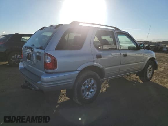 ✅ 2003 Isuzu Rodeo • VIN: 4S2DM58W734305363 • Lot: 85539774. Listed on Copart with 219,300 mi. Free auction sales archive from the USA and detailed vehicle history report at DreamBid. Image 3.