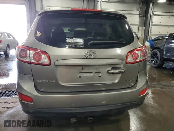 2012 Hyundai Santa Fe Limited с VIN 5XYZKDAGXCG152385, выставлен на аукционе Copart как лот 63775244 с пробегом 149 243 миль миль и Списание • Salvage title. История ставок и продаж доступна на DreamBid. Изображение 6.