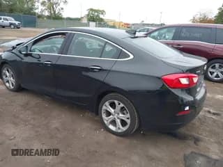 ✅ 2018 Chevrolet Cruze Premier • VIN: 1G1BF5SM1J7141701 • Lot: 43449111. Listed on IAAI with 128,825 mi. Free auction sales archive from the USA and detailed vehicle history report at DreamBid. Image 3.