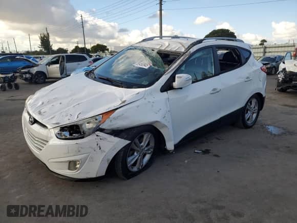 2013 Hyundai Tucson GLS with VIN KM8JU3AC6DU757207, listed as a Copart auction lot 89450945 with 164,630 mi miles and Salvage title. Bid and sale history available at DreamBid. Image 1.